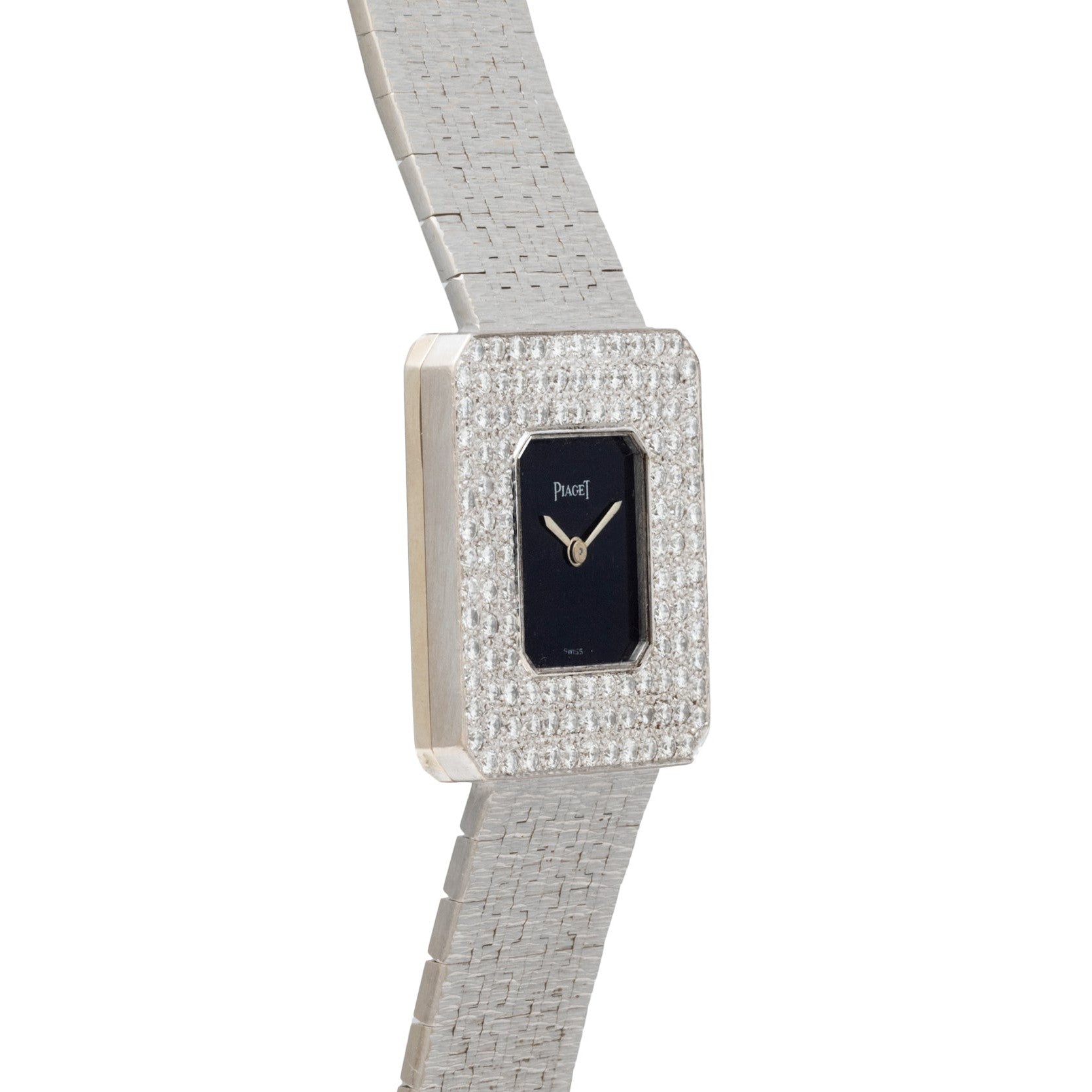 The Piaget Onyx Diamond Dress Watch features a square silver case, black dial, diamond-encrusted bezel, and a textured silver band.
