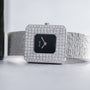 The Piaget Onyx Diamond Dress Watch features a diamond-encrusted square bezel and a textured silver band for a luxurious look.