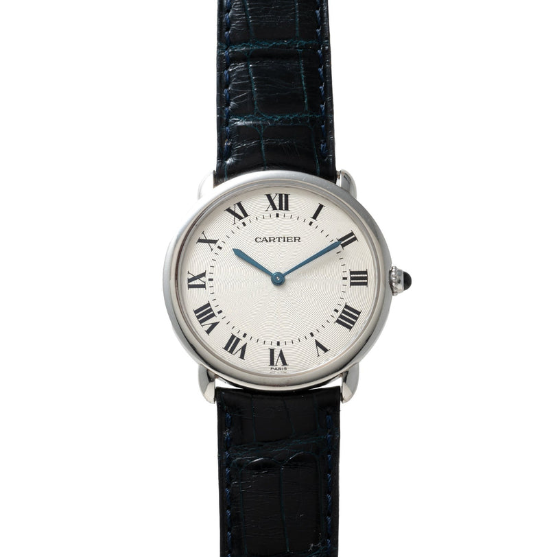The Cartier Vendome Ronde Louis wristwatch features Roman numerals, blue hands, and a black leather strap.