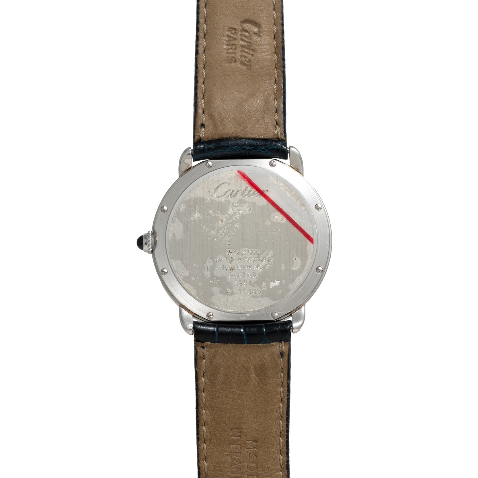 The Cartier Vendome Ronde Louis features a silver caseback with a leather strap, engraved text, and a red diagonal line across the case.