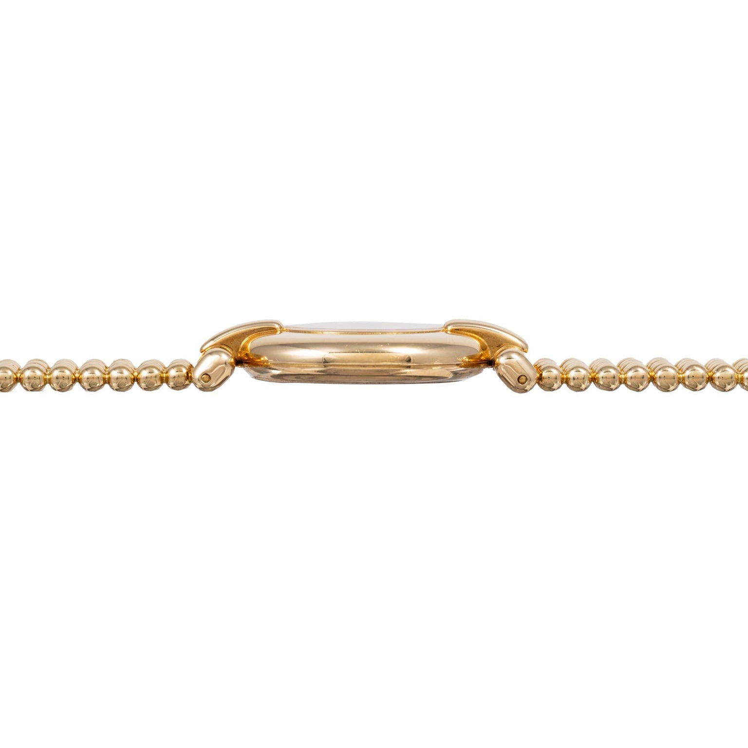 Side view of the Cartier Ladies Dress Watch featuring a gold beaded bracelet and a slim, rounded case.