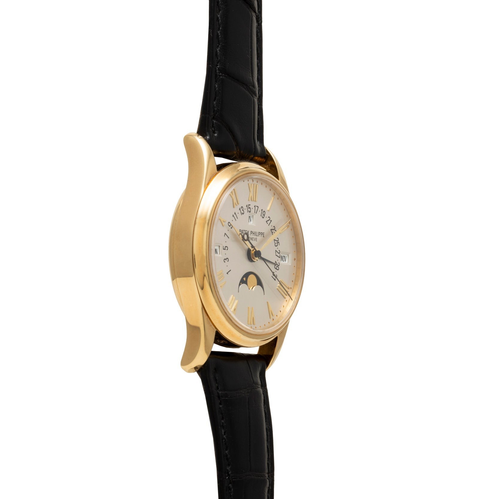 Patek Philippe Retrograde Perpetual Calendar wristwatch with white dial, Roman numerals, black leather strap, and moon phase display shown at an angle.