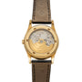 Patek Philippe Retrograde Perpetual Calendar wristwatch with a visible mechanical movement and black leather strap, shown from the back.