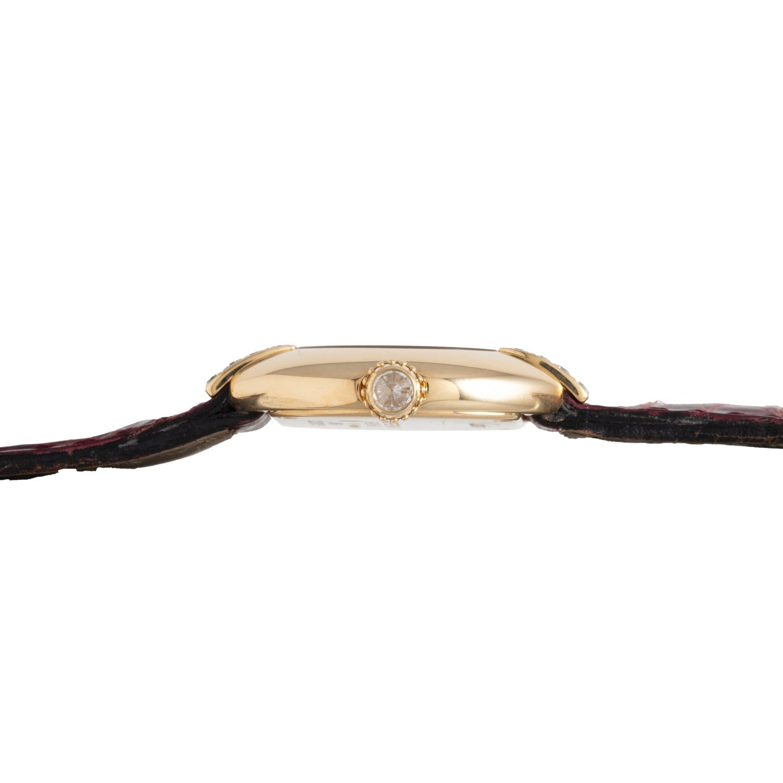 Side view of the Cartier Ellipse gold wristwatch featuring a round crown and a dark leather strap.
