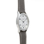 A silver Patek Philippe Calatrava Geneva Boutique Limited Edition wristwatch with a white dial and gray leather strap, displayed at an angle.