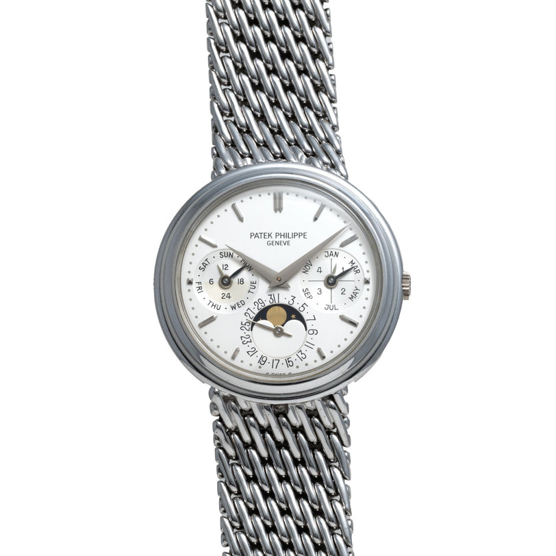 Patek Philippe Perpetual Calendar wristwatch in silver features a white dial, date subdials, and a moon phase indicator.