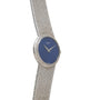 The Piaget White Gold Lapis Lazuli Dress Watch features a white gold case, a blue lapis lazuli dial, and a textured band.