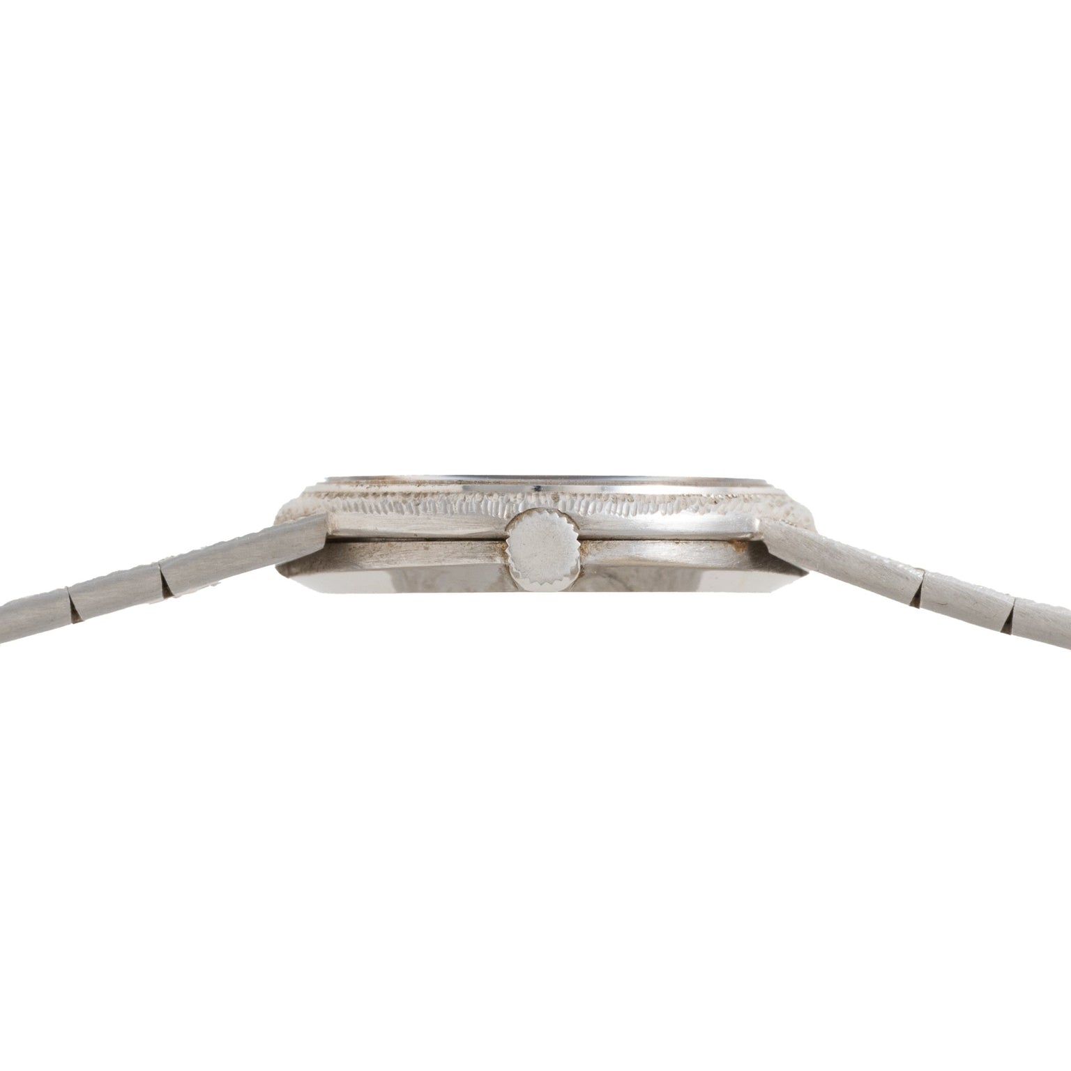 Side view of the Piaget White Gold Lapis Lazuli Dress Watch, featuring a round crown and metal band, displayed against a white background.