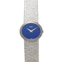 A white gold Lapis Lazuli dress watch by Piaget featuring a textured band and a blue lapis lazuli face.