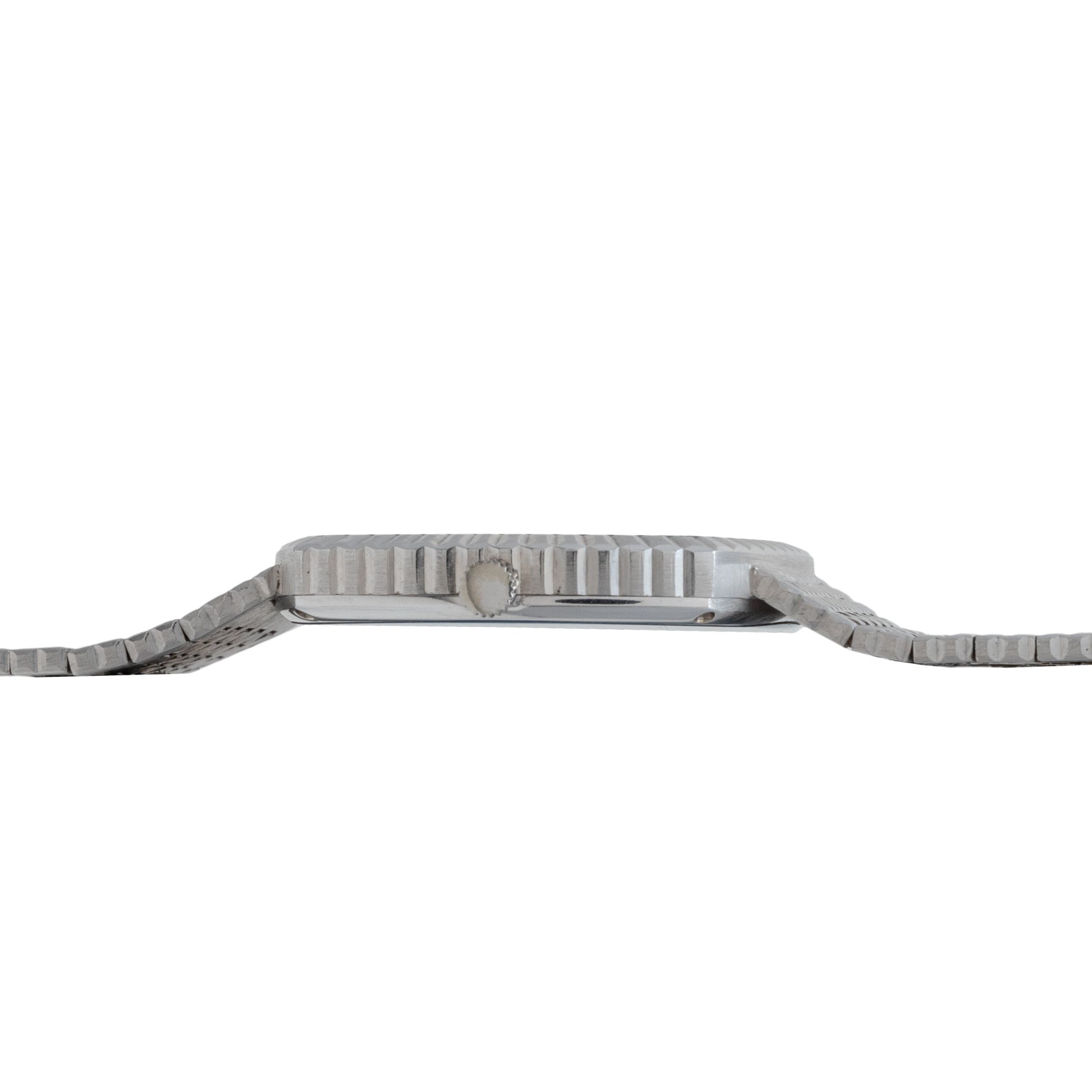 Side view of the Piaget Sqound White Gold Dress Watch with a metal band and textured bezel, laid flat.