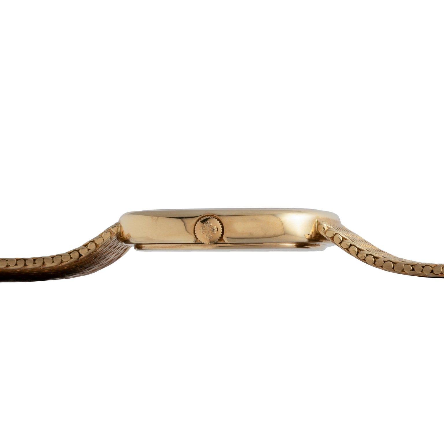 Side view of the Patek Philippe Ellipse Jumbo gold wristwatch with a brown leather strap and visible crown on a white background.