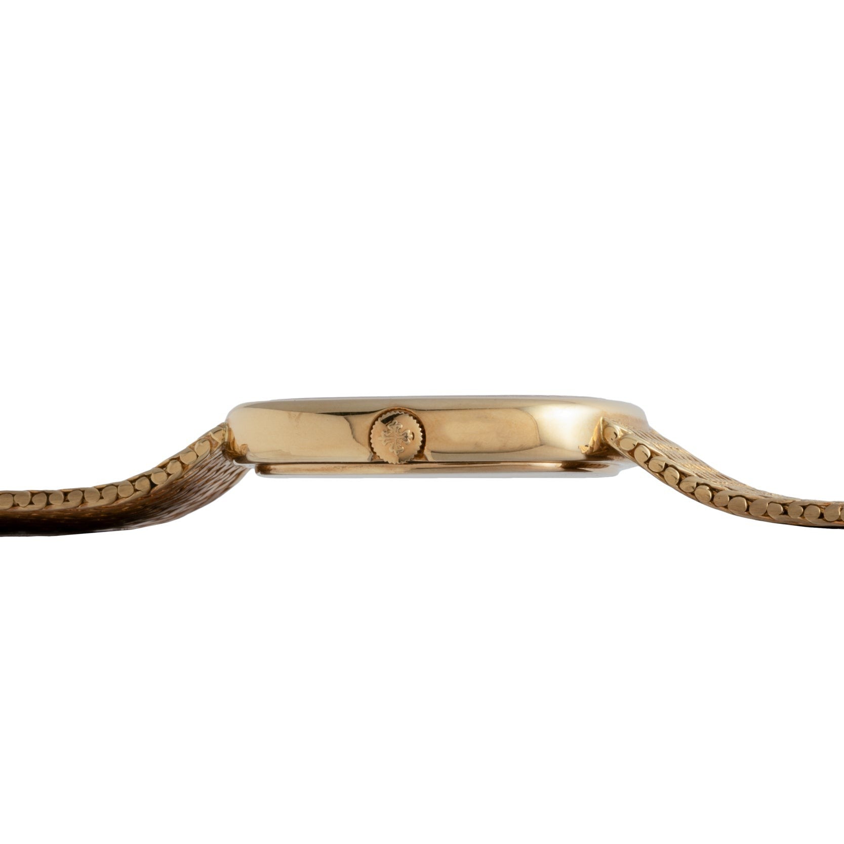 Side view of Patek Philippes Ellipse Jumbo gold wristwatch featuring a brown leather strap and a small crown on the case.