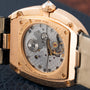 Close-up of the Cartier Baignoire Jumbos exposed mechanical movement, showcased in a gold rectangular case.
