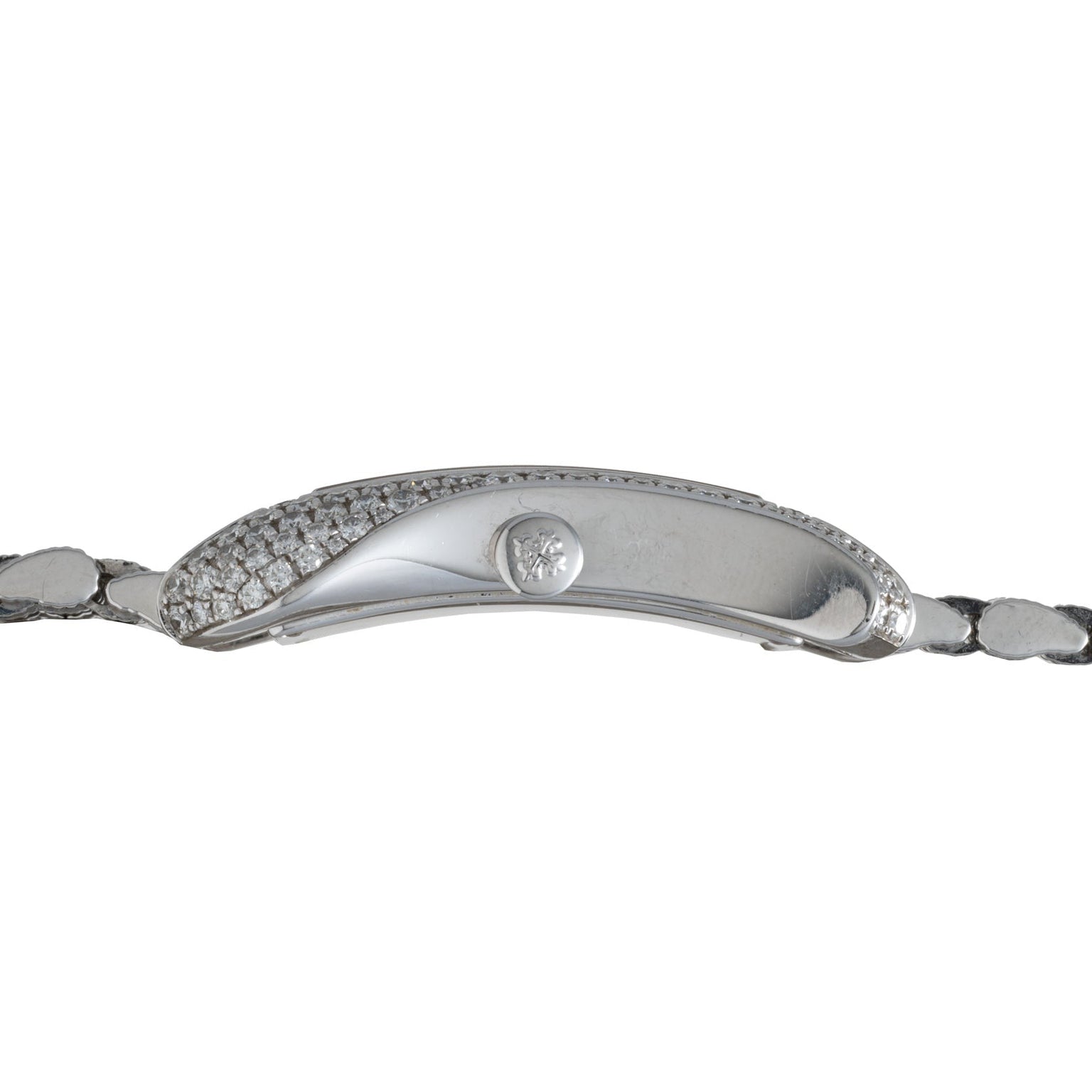 Side view of the Patek Philippe Gondolo Ladies watch, featuring a silver case with diamond accents and a textured metal band.