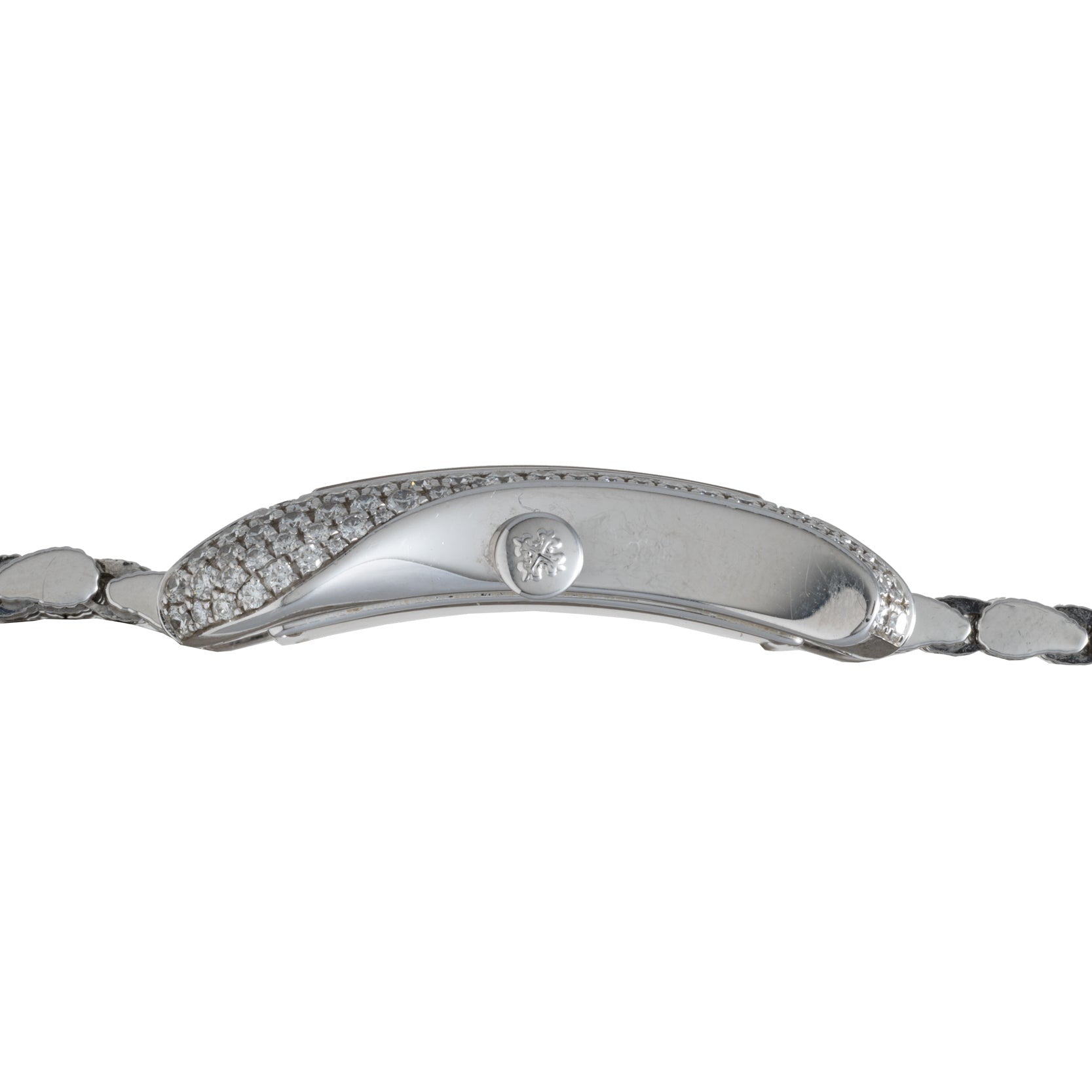 Side view of the Patek Philippe Gondolo Ladies watch, featuring a silver case with diamond accents and a textured metal band.