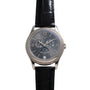 A Patek Philippe Annual Calendar Moonphase wristwatch featuring a black leather strap and a black dial with multiple subdials.