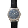 A Patek Philippe Annual Calendar Moonphase wristwatch featuring a black leather strap and dark dial with date and calendar functions.