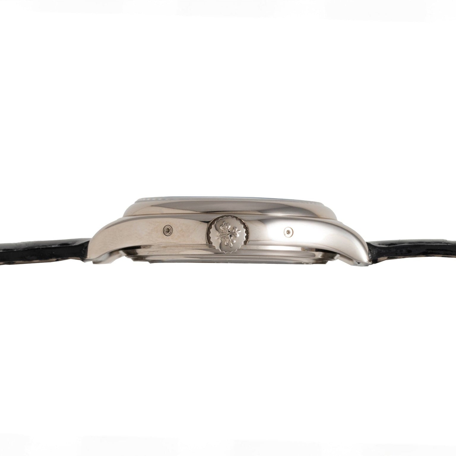 Side view of the Patek Philippe Annual Calendar Moonphase wristwatch in silver, featuring a black strap and a floral design on the crown.