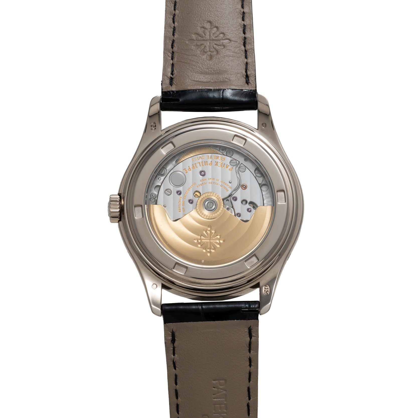 Back view of the Patek Philippe Annual Calendar Moonphase showcasing its exposed mechanical movement and tan leather strap.