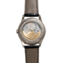 Back view of the Patek Philippe Annual Calendar Moonphase showcasing its exposed mechanical movement and tan leather strap.
