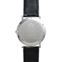 Back view of a Piaget Altiplano wristwatch featuring a black leather strap and engraved text on the metal case.