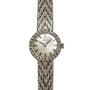 The Zenith Ladies Cocktail Watch features a diamond-studded bezel and a textured metal band, displayed against a white background.