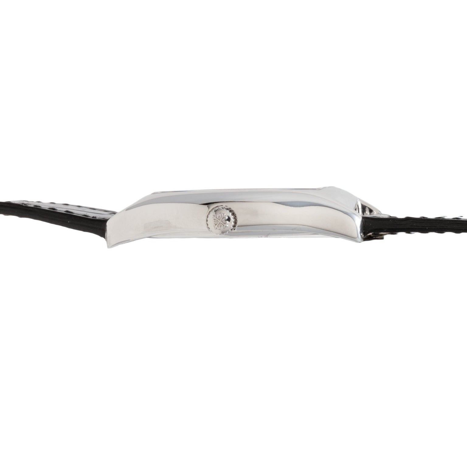Side view of the slim silver Patek Philippe Tonneau Perpetual Calendar wristwatch featuring a black leather strap and a small crown.