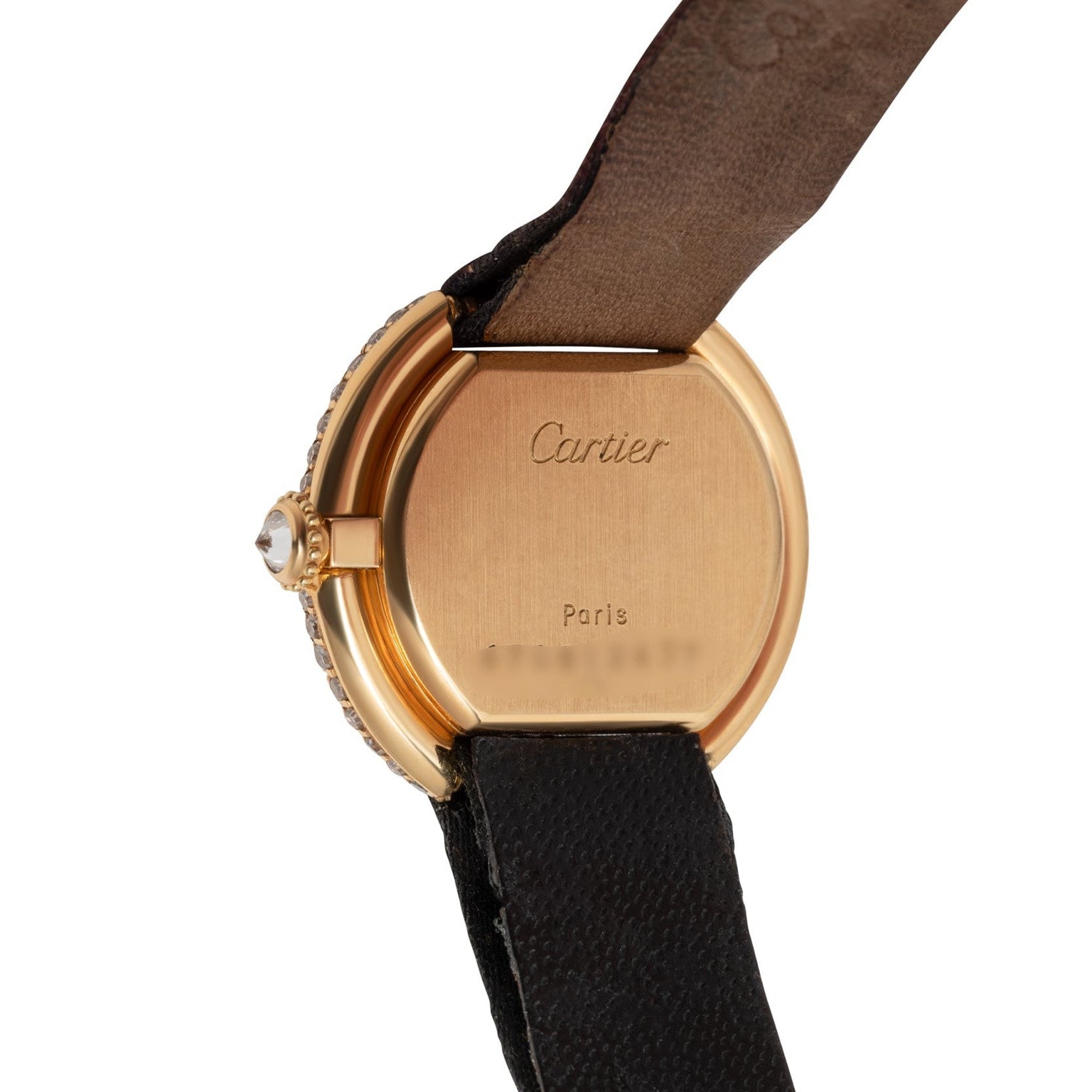 The Cartier Ellipse features a gold case back engraved with Cartier and Paris, complemented by a black leather strap.