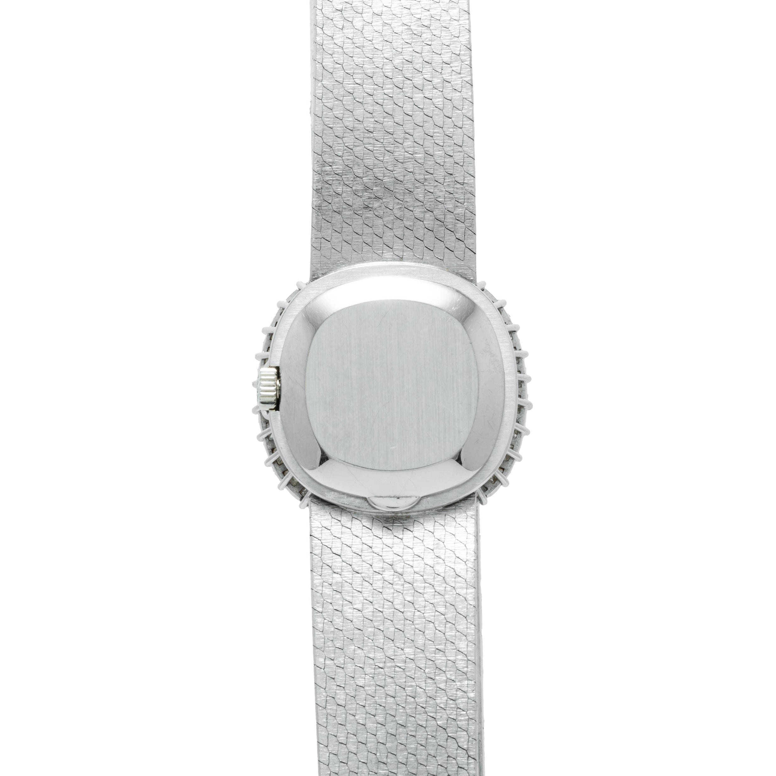 The Patek Philippe Ellipse Ladies Dress Watch features a silver textured band and a plain, square face, viewed from above.