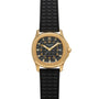 The Patek Philippe Aquanaut features a gold case, black textured strap, black dial with gold hour markers, and a date display.