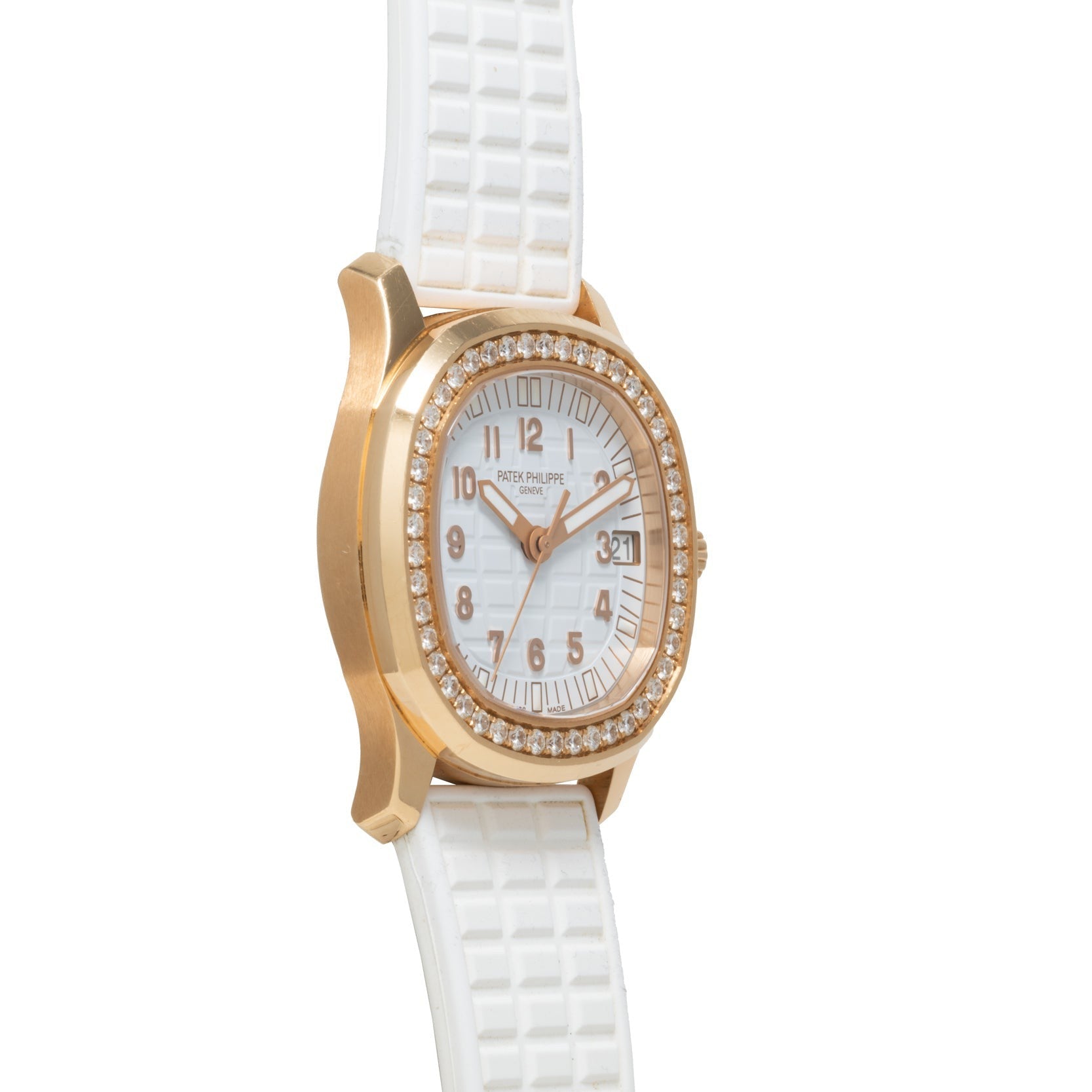 Patek Philippe Aquanaut Ladies watch with a white face, diamond bezel, and textured white strap, displayed at an angle.