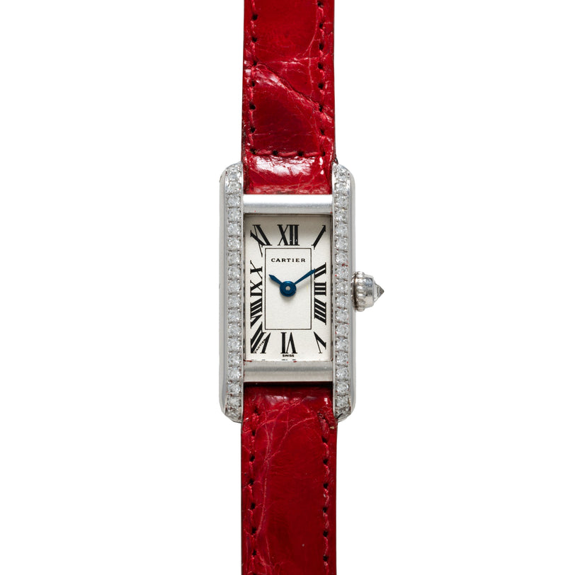 Cartier Tank Louis Mini watch featuring a rectangular case, red leather strap, diamond bezel, and Roman numeral dial.