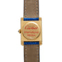 A Cartier Tank Louis Diamonds watch with a leather strap, labeled Cartier International Service on the back.