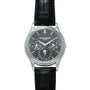 A Patek Philippe Perpetual Calendar wristwatch with a black leather strap and a black dial featuring multiple subdials.