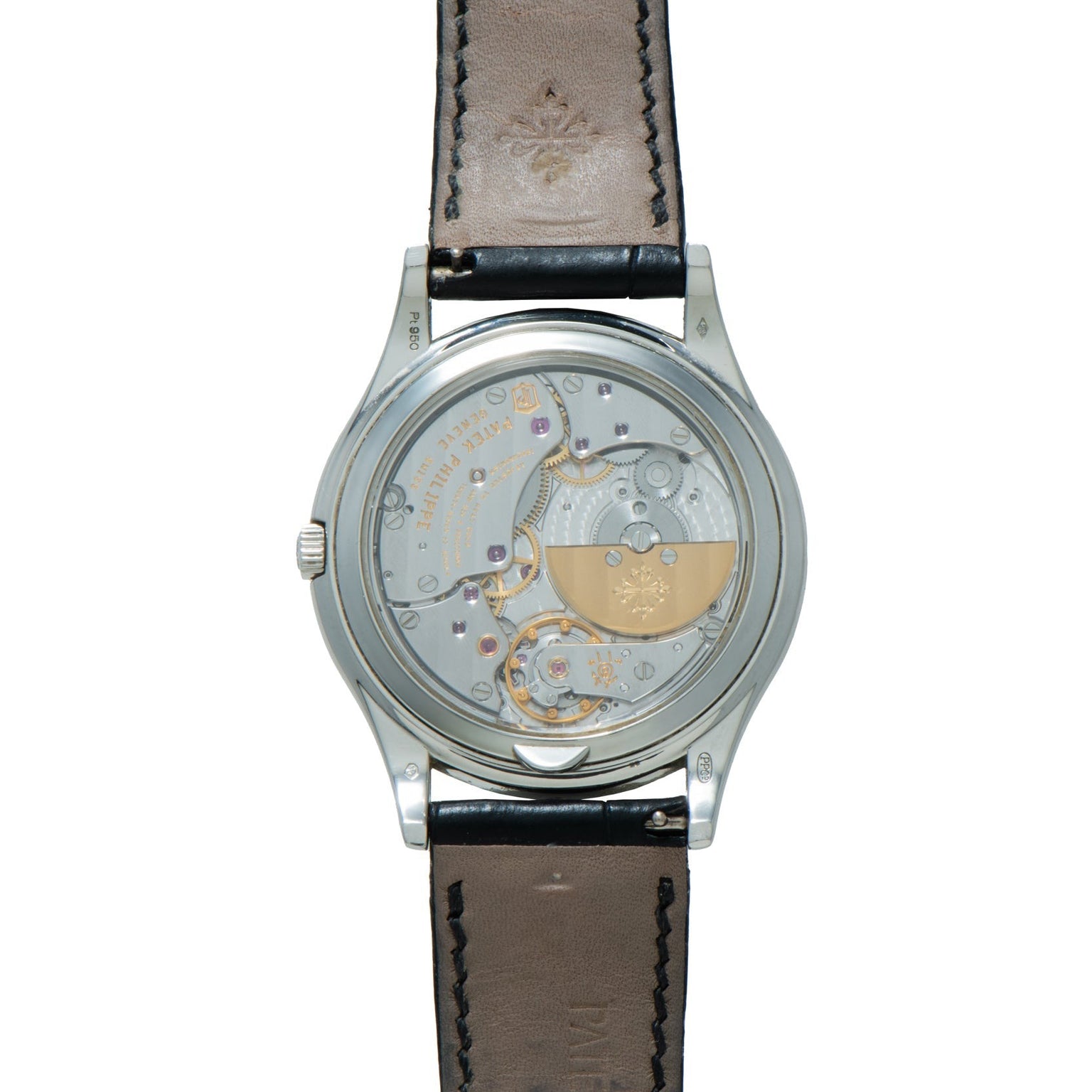 Back view of the Patek Philippe Perpetual Calendar luxury wristwatch showcasing its mechanical movement and brown leather strap.