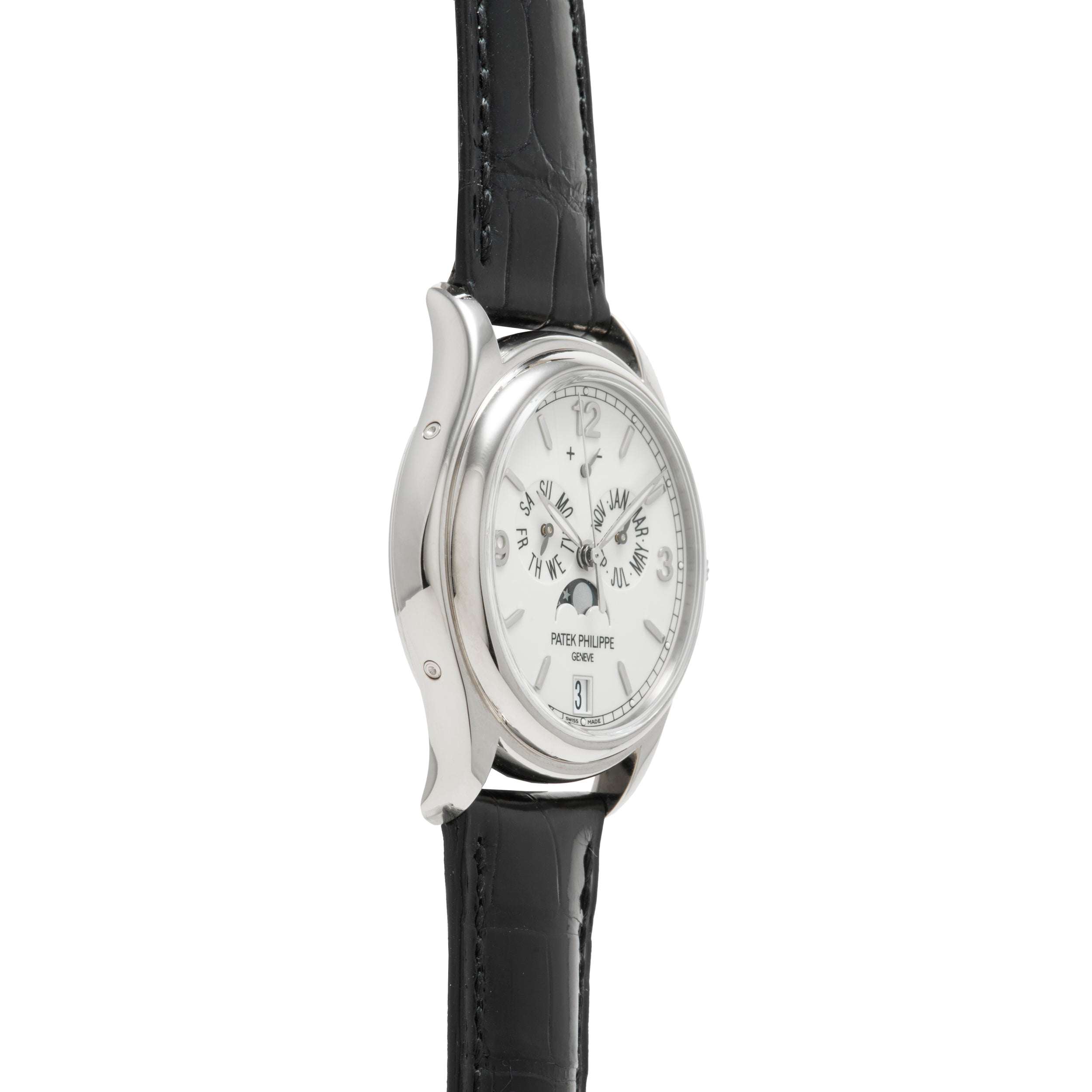 Side view of a Patek Philippe Annual Calendar Moonphase wristwatch featuring a silver case, white dial, black leather strap, multiple subdials for the annual calendar, moon phase display, and date window.