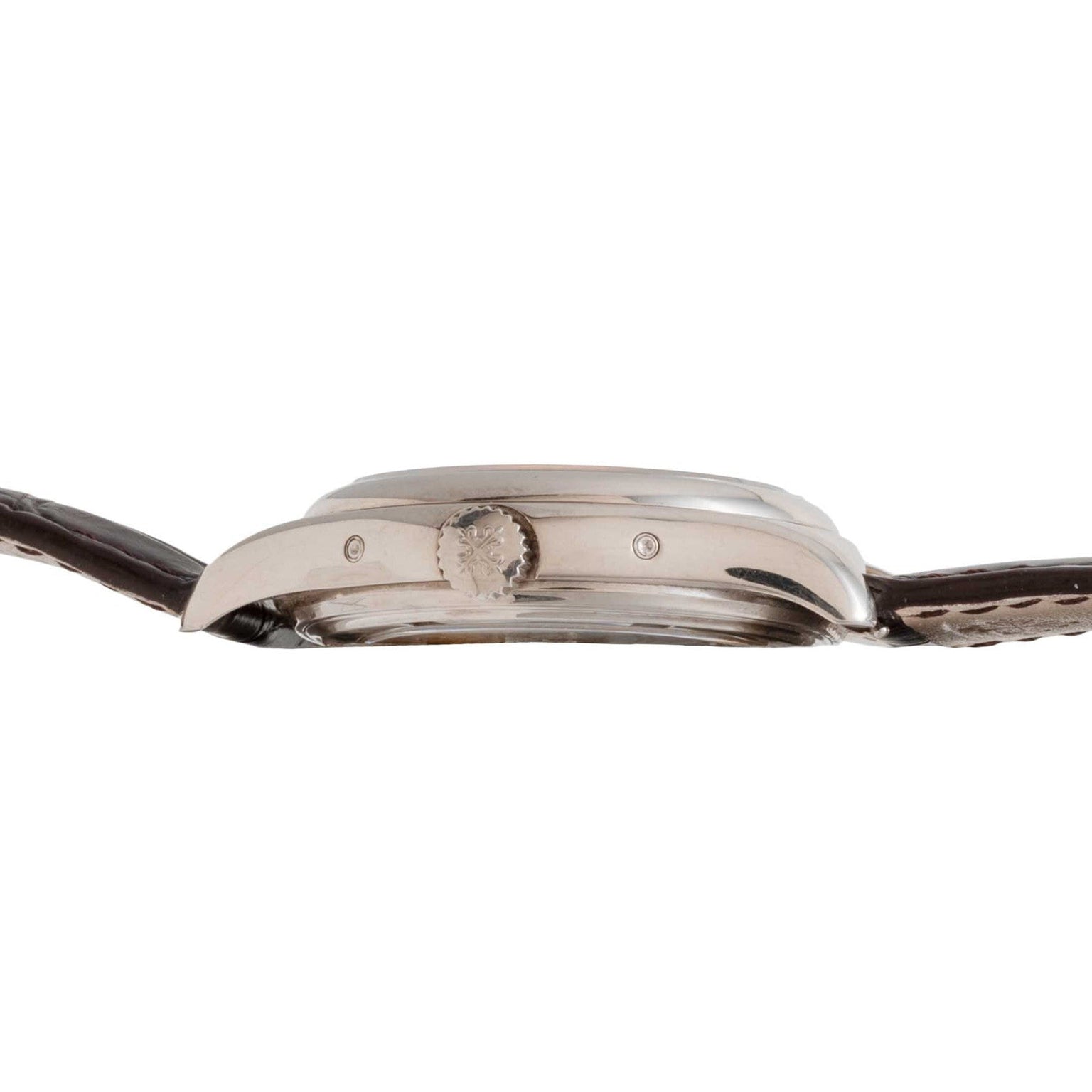 Side view of the Patek Philippe Annual Calendar Moonphase, featuring a silver case, central crown, and brown leather strap.