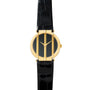 The Piaget Polo Onyx is a gold watch with a black face and black leather strap, featuring three vertical gold bars over the dial.