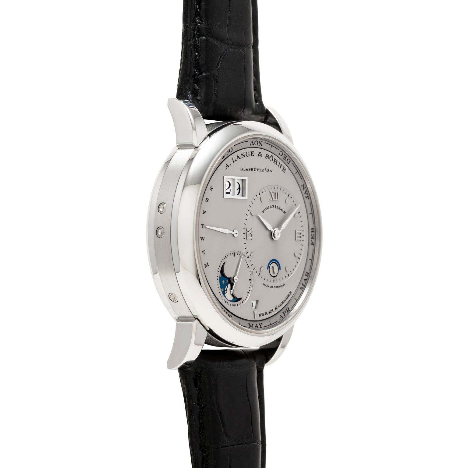 Side view of the Lange & Sohne Lange 1 Tourbillon Perpetual Calendar, a luxury silver wristwatch with a black leather strap and multiple dials on the face.