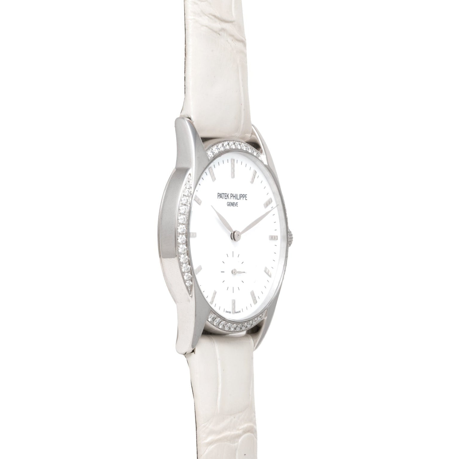 Side view of the Patek Philippe Calatrava watch featuring a white strap and diamond-set bezel, displayed on a white background.