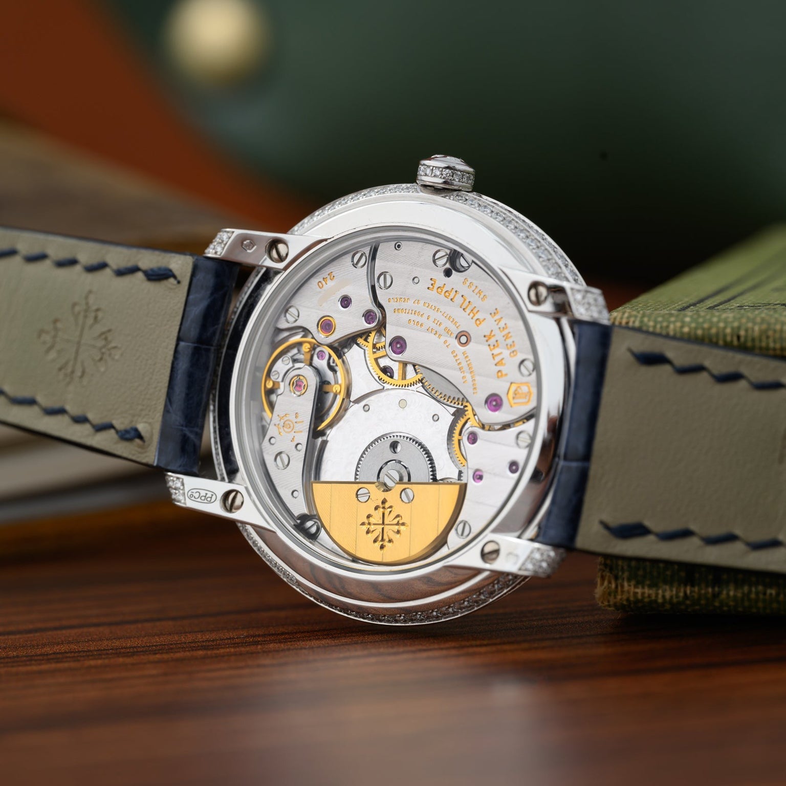 Close-up of the Patek Philippe Calatrava’s exposed mechanical movement, highlighting its intricate gears and exquisite detailing.