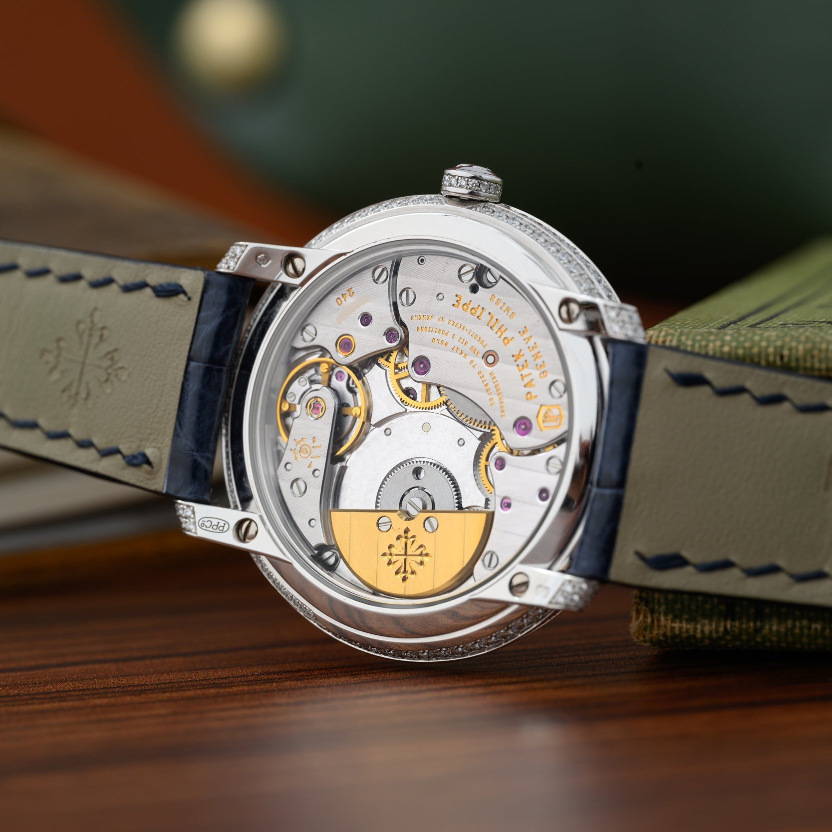 Close-up of the Patek Philippe Calatrava’s exposed mechanical movement, highlighting its intricate gears and exquisite detailing.