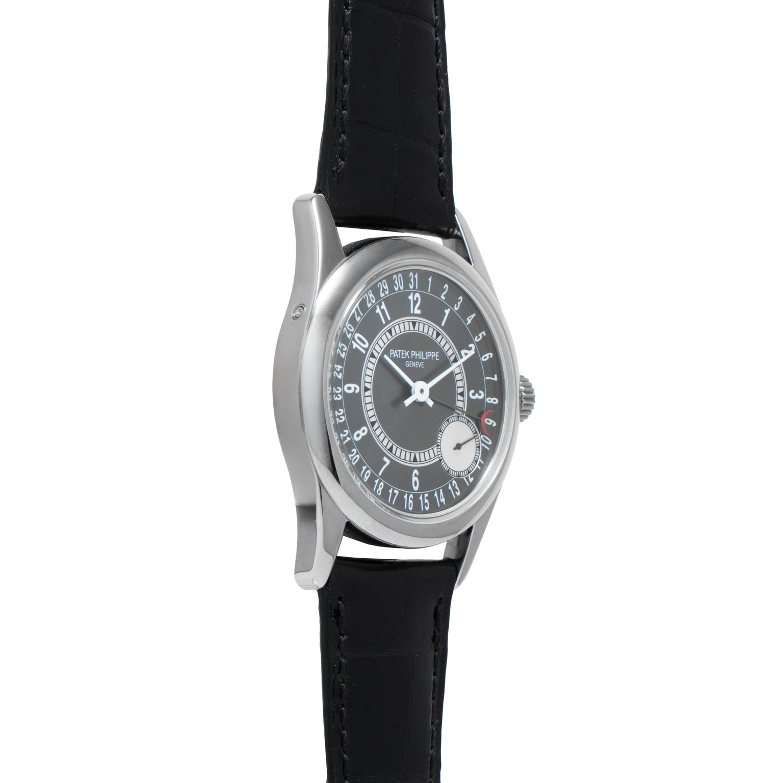 The Patek Philippe Calatrava is a silver wristwatch with a black leather band and a round black dial featuring the date around the edge.
