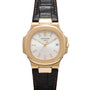 Patek Philippe Nautilus wristwatch with a white dial, date window, and black leather strap.