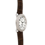 The Patek Philippe Ladies Complication features a diamond bezel, white dial, and brown leather strap, shown from a side angle.