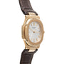 Patek Philippe Nautilus wristwatch with a brown leather strap, white dial, gold hour markers, and an angled view.