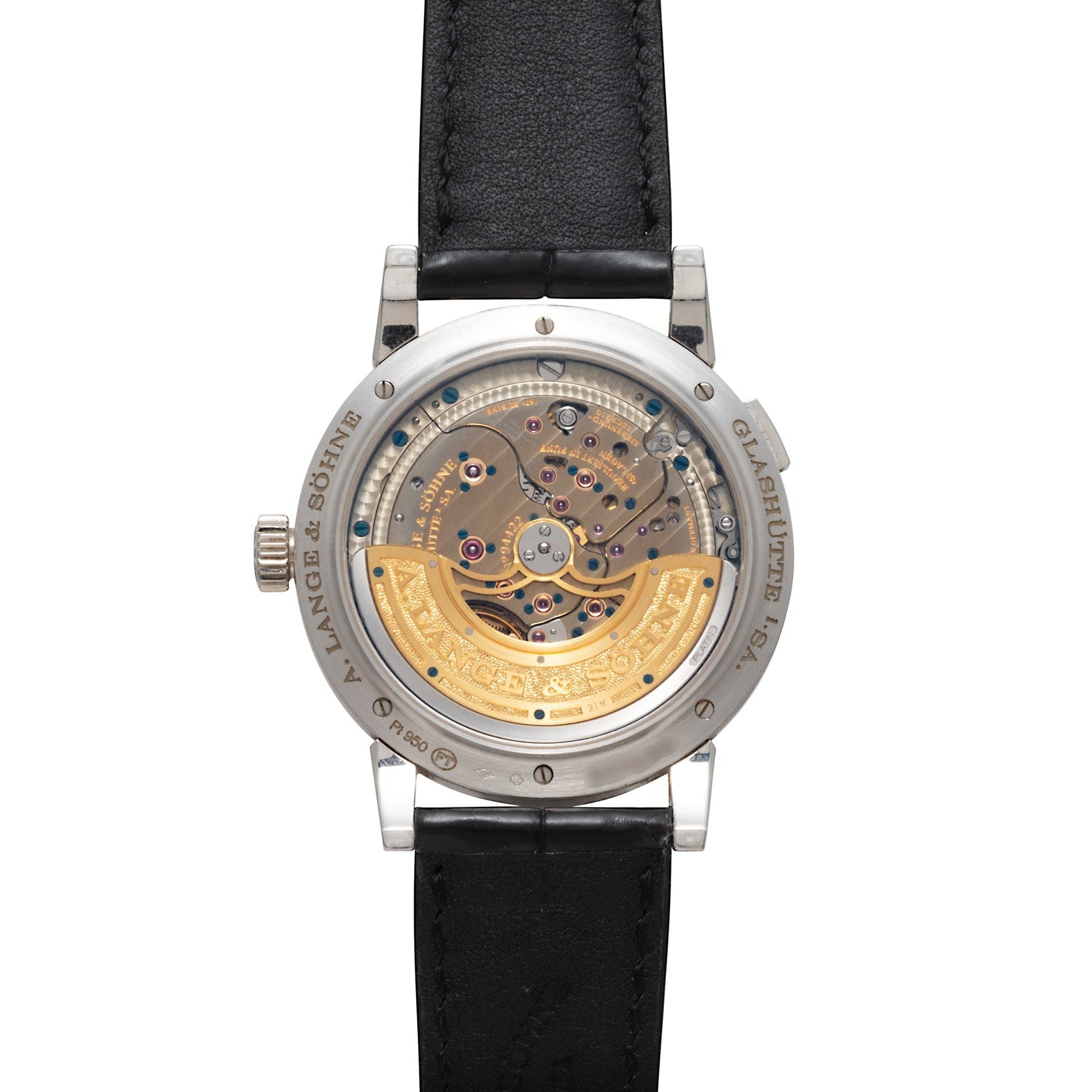 Back view of the Lange & Sohne Lange 1 Daymatic features an exposed mechanical movement with a gold rotor and a black leather strap.