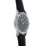 Side view of a Patek Philippe Calatrava wristwatch featuring a black leather strap and a dark dial.