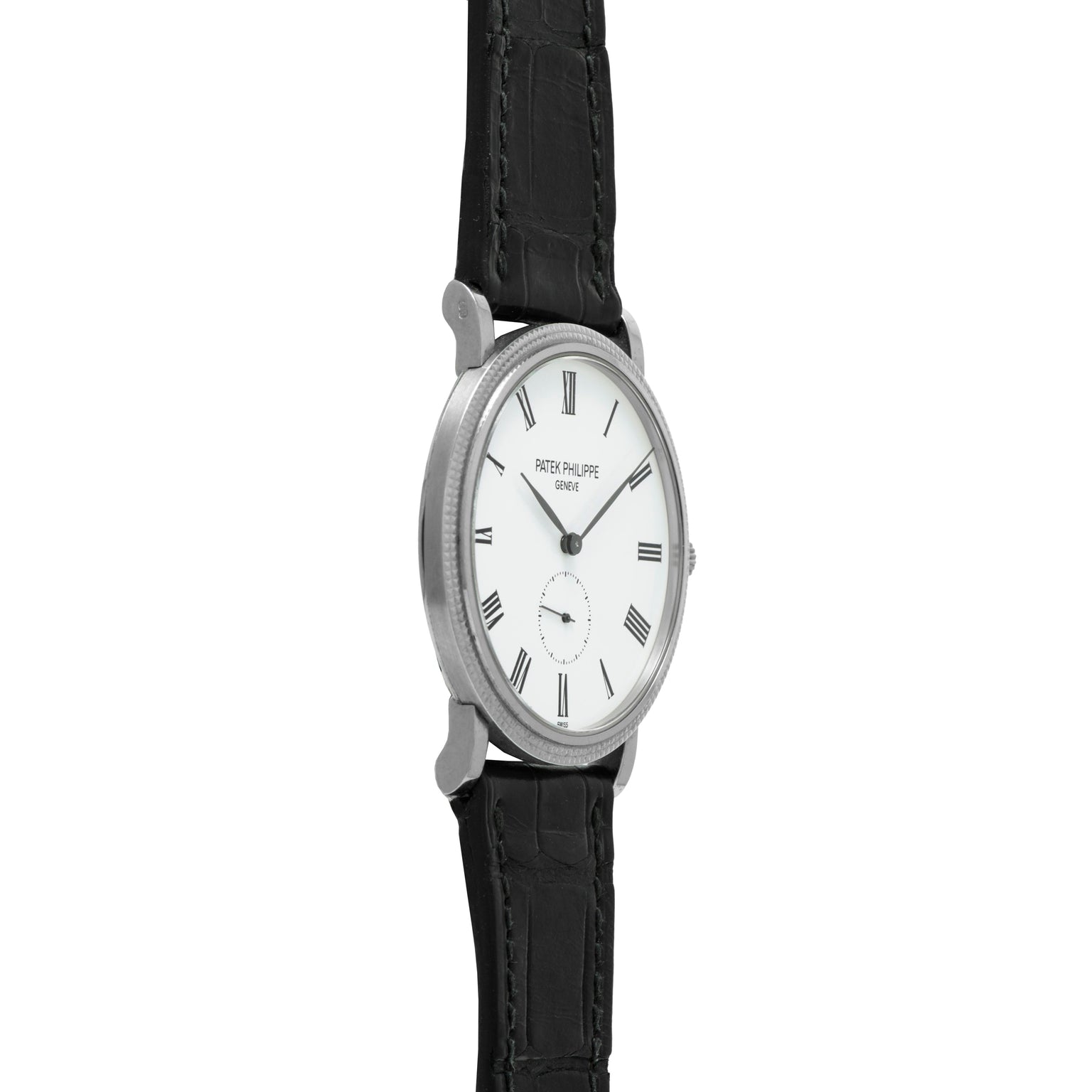The Patek Philippe Calatrava is shown from the side, featuring a silver case, white dial with black Roman numerals, and a black leather strap.