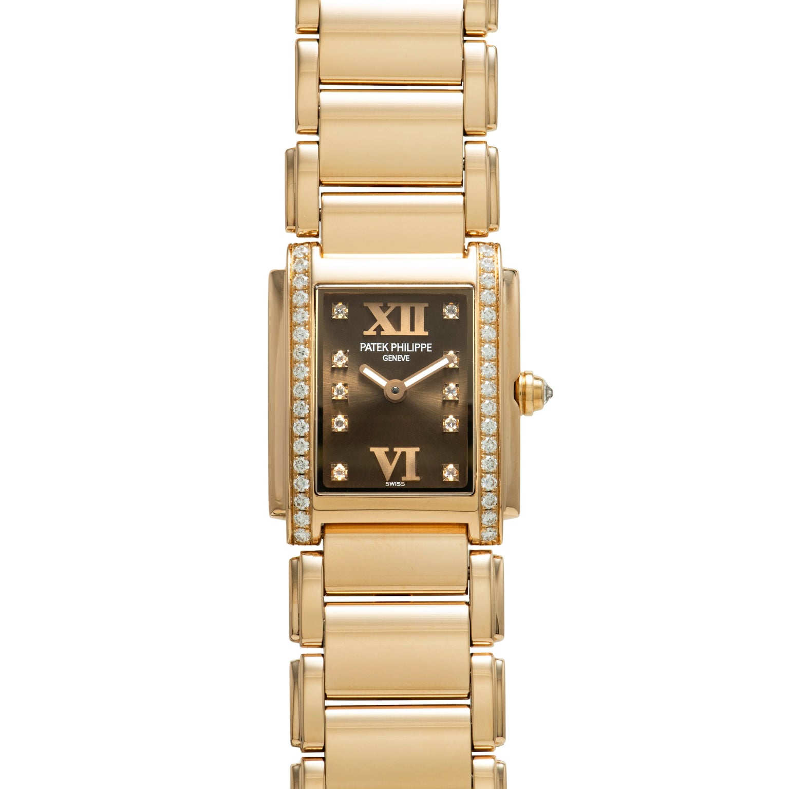 Patek Philippe Twenty-4 gold watch featuring a rectangular face, diamond accents, and Roman numerals at 12 and 6.